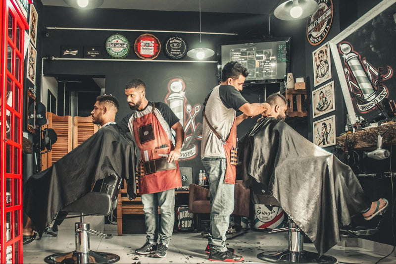 Men Getting Their Hair Cut in Barber Shop