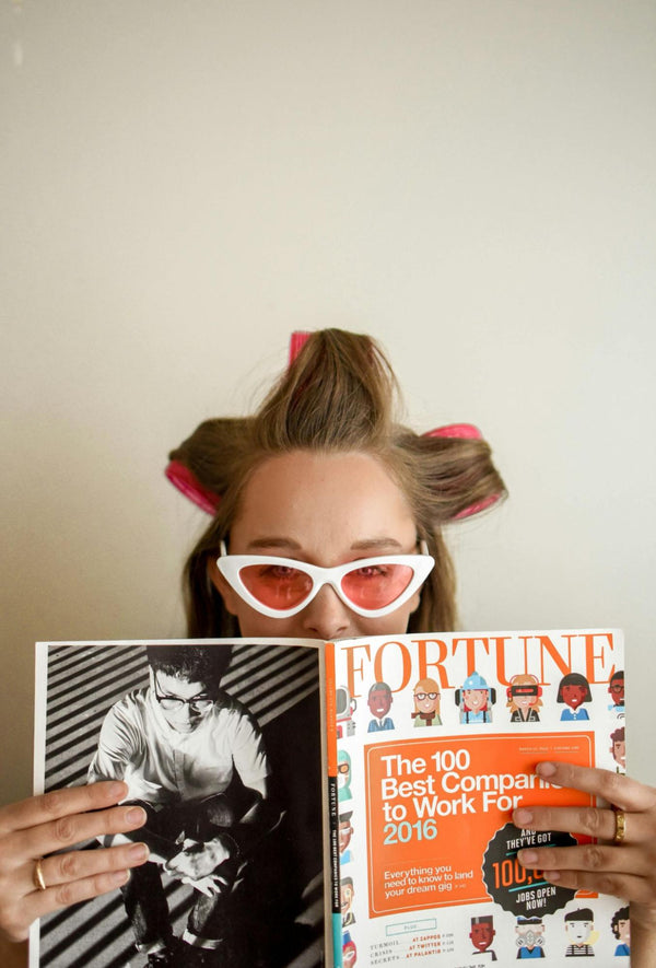 Woman with Curlers and Magazine