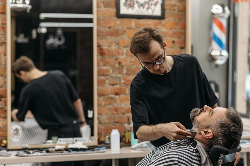 Man Getting Beard Shaved in Barbershop