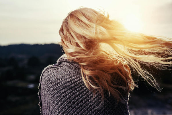 Blonde Hair Blowing in Wind