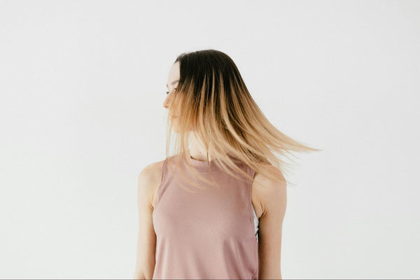 Woman Flipping Her Straight Ombré Blonde Hair