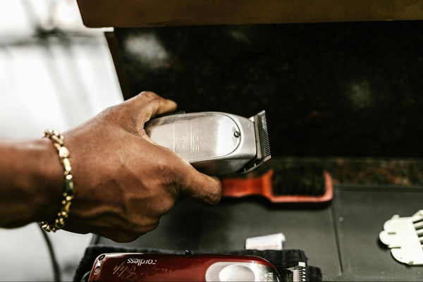 Person Holding Hair Clippers