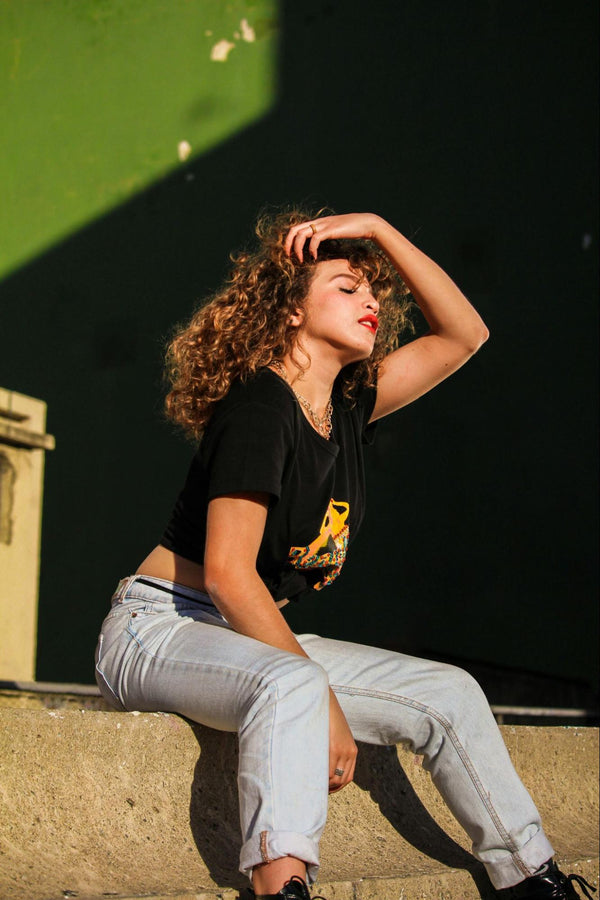 Woman with Curly Hair in Sunshine