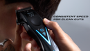 Wahl cordless clipper held near hair, black body with blue illuminated button