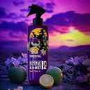 Purple aftershave bottle three-quarter view with black spray nozzle and graphic label.