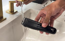Black body trimmer used in sink water, with visible comb and control button