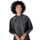Black styling cape with high rounded neckline and smooth, glossy fabric