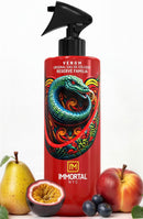 Aftershave spray bottle with red liquid, black sprayer nozzle, Venom artwork label.