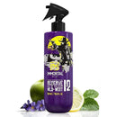 Purple aftershave bottle with black spray nozzle and bold graphic label, front view.