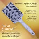 Lavender paddle hair brush with black bristle tips for detangling and smoothing