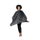 Black styling cape with high neck and flowing cape hem, draped silhouette