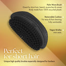 Black oval wave brush with gridded bristle pins and textured cushioned base
