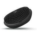 Black oval palm wave brush with dense rubberized bristle tips on textured cushion