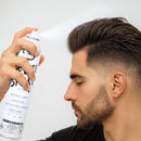 L3VEL3 Freeze Hair Spray can held in hand near styled dark hair
