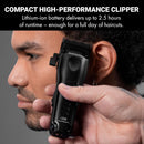 Compact black hair clipper held in hand with close-up of cutting head