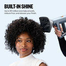 Hair dryer with nozzle attachment drying curly hair