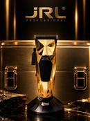 Gold JRL Professional hair clipper on black base, comb teeth facing up