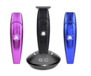 Set of hair trimmers: purple, black, and blue units on a matching charging stand.