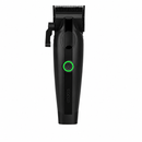 Black cordless hair clipper, front view with green-lit power button