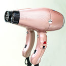 Rose gold hair dryer front view with black dryer outlet and side switches