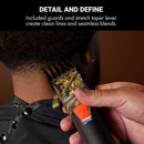 Hair clipper held against skin, camo blade and orange adjustment switch visible