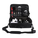 Open black barber travel case with tool slots, elastic pockets, and transparent pouch