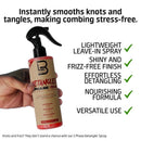 Hand holding hair detangling spray bottle with black trigger sprayer.