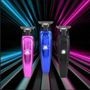 Pink, blue, and black hair trimmers with guard heads and charging bases