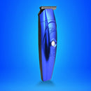 Blue electric hair trimmer with metal cutting comb and round power button.