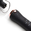 Interchangeable curling handle close-up, dark body with rose-gold cap and temperature marks