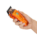 StyleCraft Saber 2 cordless clipper held in hand, orange body with black blade