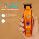 Orange cordless hair trimmer held in hand with blue power hex button