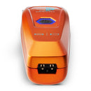 Orange cordless trimmer top close-up with blue power button and charging contacts