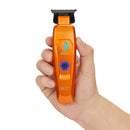 Orange cordless trimmer held upright with black blade and blue hex control