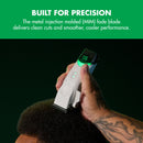 White hair clipper with green LED display held in a hand for grooming