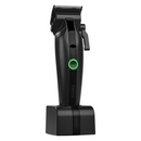 Black cordless hair clipper on charging base dock with green power ring