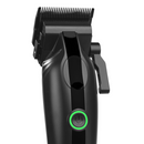 Black cordless hair clipper close-up of blade housing with green power button