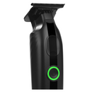 Black cordless hair trimmer front view, green power button and blade guard