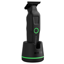 Cordless clipper on charging base, black body with green accent ring