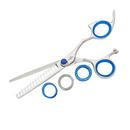 Texturizing haircut shears with blue rings, stainless handles, and serrated shark-fin teeth