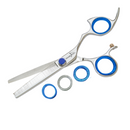 Texturizing shears with blue finger loops, stainless steel body, and serrated shark-fin blade