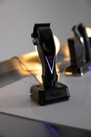 Wahl cordless hair clipper on charging dock, purple light pattern on front