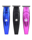 Three electric hair trimmers shown: blue, black, and pink with round power buttons.
